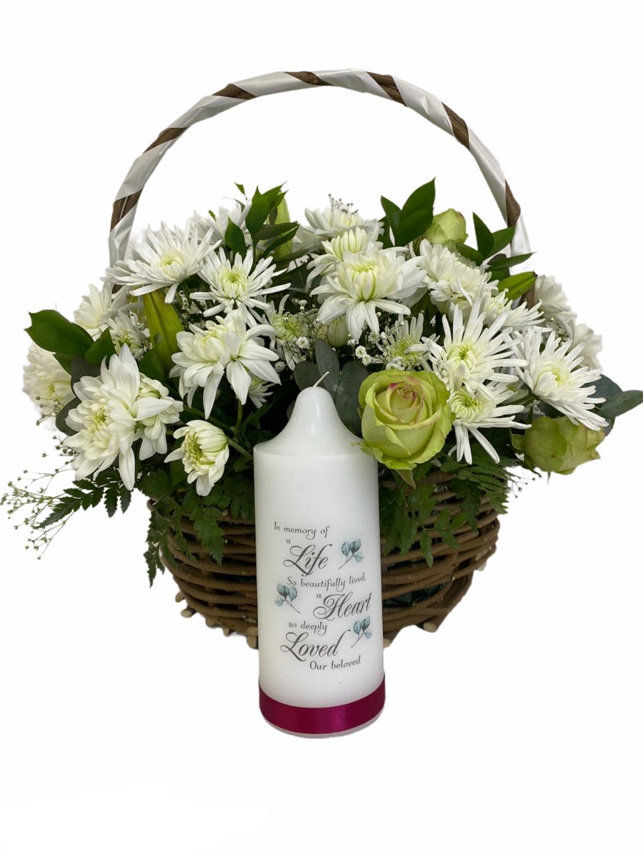 Sympathy basket of flowers with a large candle